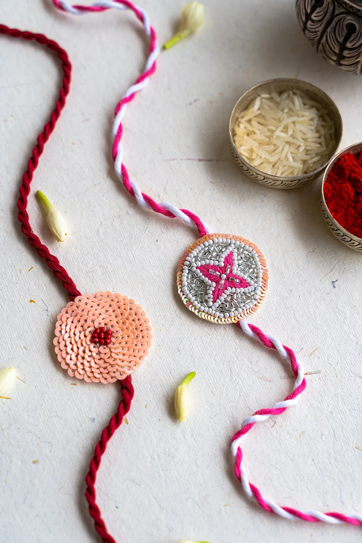 Hydrangea and Pink Periwinkle Embroidered Rakhi - Set of 2